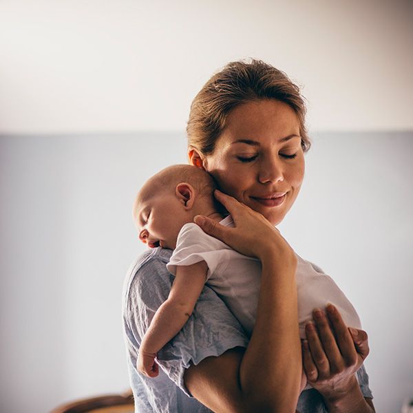 mother holding baby